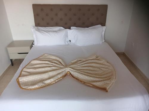 Ein Bett oder Betten in einem Zimmer der Unterkunft Sen hôtel
