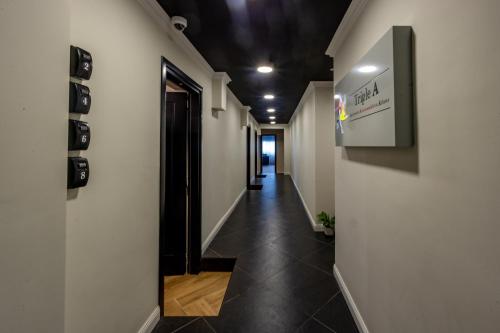 a hallway of an office building with a hallway at Triple A - Chic & Elegant by the Market - FREE parking! in Athens