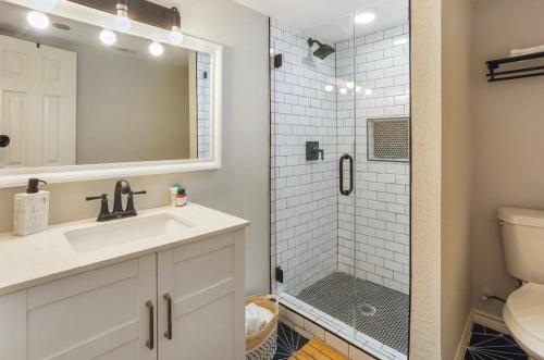 a bathroom with a sink and a shower at Cozy Heights 2 BD Bungalow, Walkable in Houston