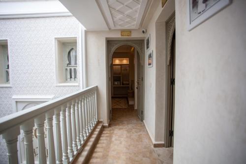 a hallway of a home with a stairway at Riad Luxe Nomade Marrakech & Spa in Marrakech