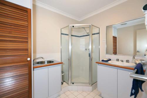 a bathroom with a shower and a sink at Scarborough Beach Front Resort - Shell Seven in Perth