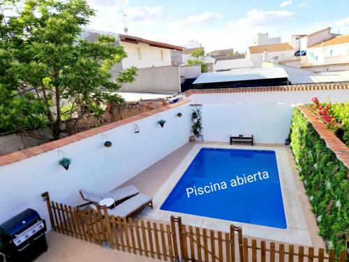 a swimming pool on the roof of a house at Burbujas Manchegas in El Toboso