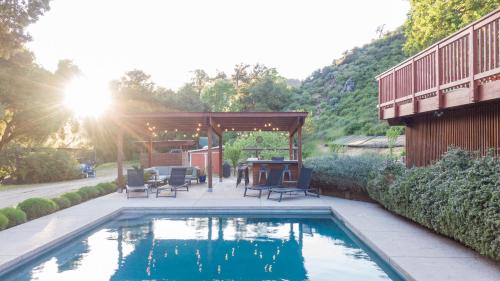 a swimming pool in a backyard with a gazebo at Serene Vineyard Chateau with Pool, Hot Tub, BBQ in Carmel Valley