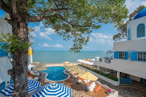 a view of the ocean from the balcony of a hotel at Sea of Love Suite Cafe Pattaya in Bang Sare