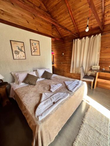 Katil atau katil-katil dalam bilik di Recanto dos Pássaros