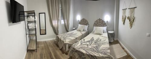Postel nebo postele na pokoji v ubytování La Sonrisa de Niki