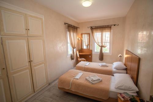 Postel nebo postele na pokoji v ubytování Hotel Argo