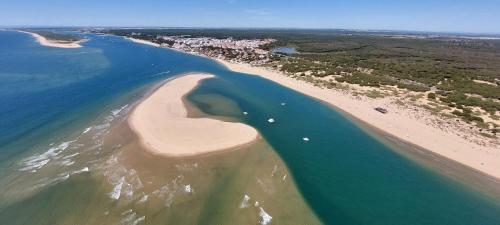 an aerial view of a beach and the ocean at Pinos del Mar in Huelva