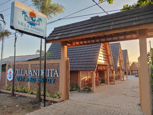 a building with a sign in front of a building at Villa Andhita Pantai Garut in Mancagahar