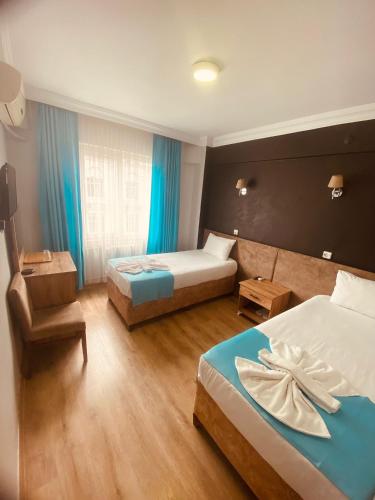 Postel nebo postele na pokoji v ubytování Malkoç Hotel