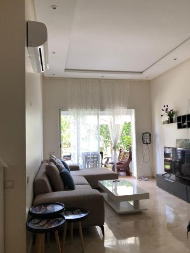 Posezení v ubytování Appartement moderne CASABAY BEACH Sidi Rahal