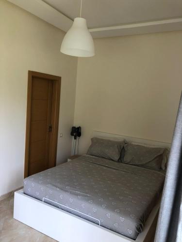 Postel nebo postele na pokoji v ubytování Appartement moderne CASABAY BEACH Sidi Rahal