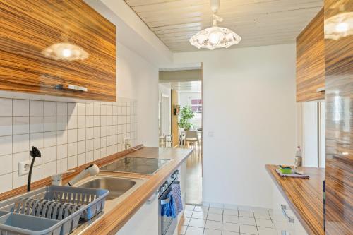 a kitchen with a sink and a counter at home2stay Apartments Wendlingen Kitchen,Wifi,Smart TV NEW in Wendlingen am Neckar