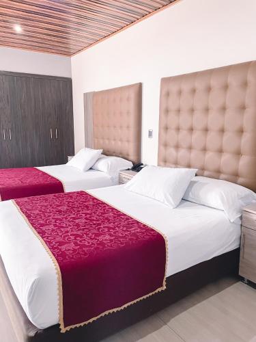 Katil atau katil-katil dalam bilik di Hotel Punta Arena Spa Boutique