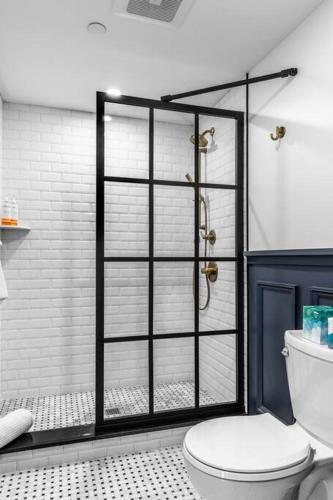 a bathroom with a shower and a toilet in it at Historic BLDG, Coffee Shop, FAST Wi-Fi, Room # 207 in Bangor