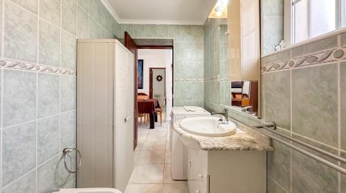 a bathroom with a sink and a toilet at Quinta de Sta Teresa by Villas Key in Lagoa