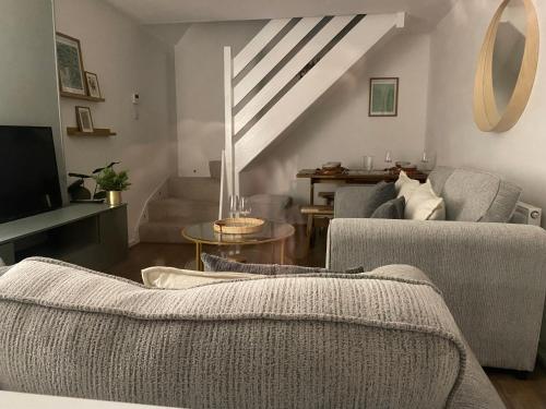 a living room with two chairs and a couch at Cosy home close to M6 motorway in Pemberton