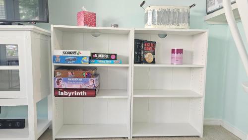a white book shelf with books on it at 2BR/2BA Condo at Arcadian Dunes Building 10-238 in Myrtle Beach