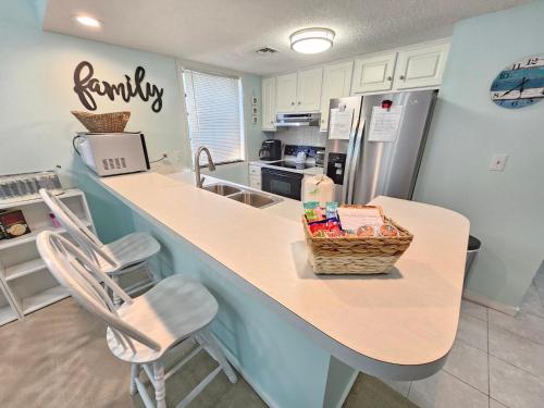 a kitchen with a counter with a basket on it at 2BR/2BA Condo at Arcadian Dunes Building 10-238 in Myrtle Beach