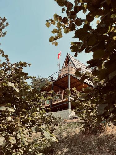a building with an american flag on top of it at The overlook cottage 2 in Keda