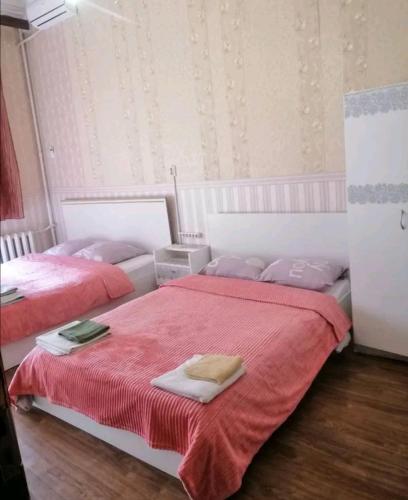 Säng eller sängar i ett rum på Ланжероновская угол Дерибасовская