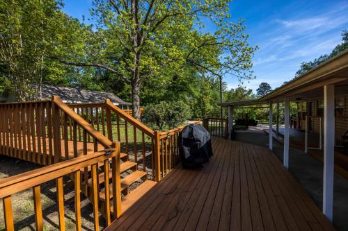 a wooden deck with a backpack on it at Quaint and quiet Columbus Ga stay in Columbus