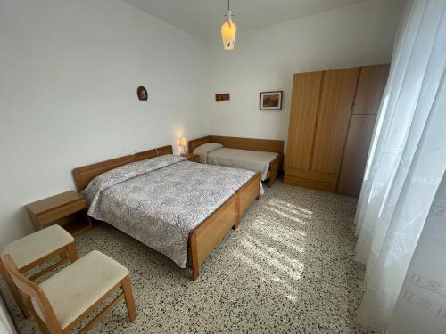 Postel nebo postele na pokoji v ubytování Villa Rita - AGENZIA COCAL