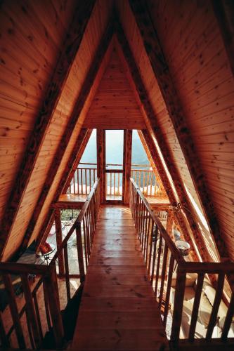 a wooden walkway in a wooden cabin with windows at The overlook cottage 2 in Keda