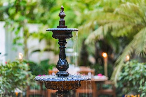 a close up of a water fountain in a garden at Casa Grande - Grace Bay Beach in The Bight Settlements
