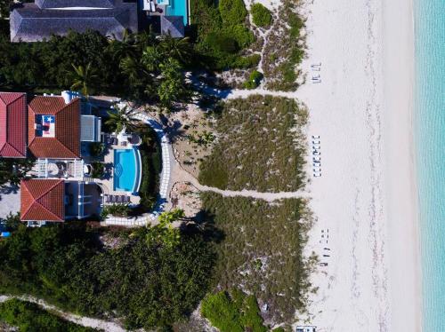 an aerial view of a house and the beach at Casa Grande - Grace Bay Beach in The Bight Settlements