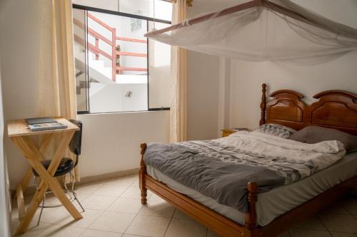 Tempat tidur dalam kamar di Casa mar surfhouse