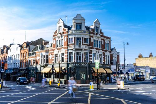 a large building on a city street with people crossing the street at Large Bedroom in beautiful house in London