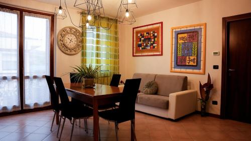 a living room with a table and a couch at Florivana Boutique Hotel Ristorante in San Pietro in Cariano