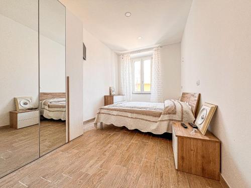 En eller flere senge i et værelse på Albeleo Apartments