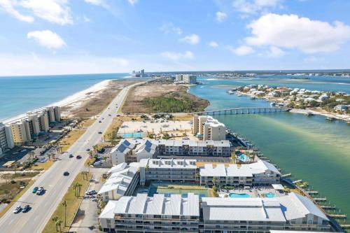 an aerial view of a beach with buildings and the water at Lei Lani Village 112 by Vacation Homes Collection in Orange Beach