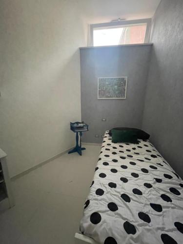 a small bedroom with a bed and a window at Manu's House Villetta Indipendente in Monte di Procida