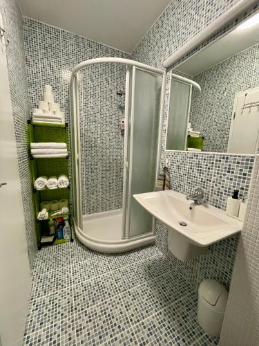 a bathroom with a shower and a sink at Apartman Marta in Klek