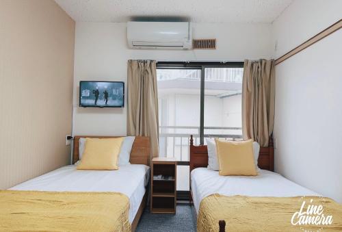 Llit o llits en una habitació de Momo palace