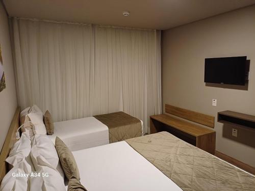 Postel nebo postele na pokoji v ubytování Laghetto Golden Resort