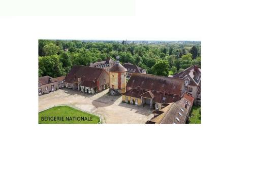 an aerial view of a large building with a tower at St-Quentin-en-Yvelines Plusieurs appartements avec parking in Trappes