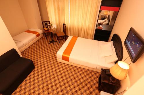 Ένα ή περισσότερα κρεβάτια σε δωμάτιο στο Holiday Xpress
