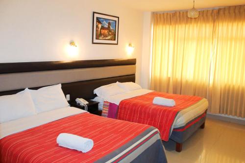Postel nebo postele na pokoji v ubytování Hotel Reggia
