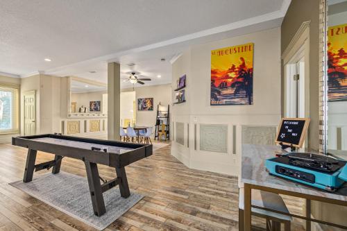 a living room with a ping pong table in it at The Ray - Penthouse Suite - 360° Rooftop View in St. Augustine