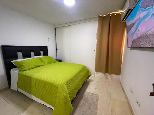 Ένα ή περισσότερα κρεβάτια σε δωμάτιο στο Apartamento para viajeros Aeropuerto Maiquetia