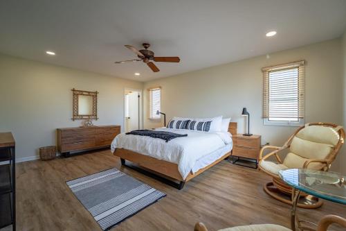 a bedroom with a bed and a ceiling fan at Luxury Waterfront Villa Dock Game Room Sunset Views in Ocean City