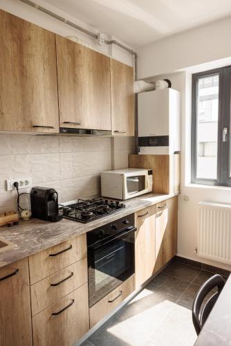 Η κουζίνα ή μικρή κουζίνα στο Runcu Apartment