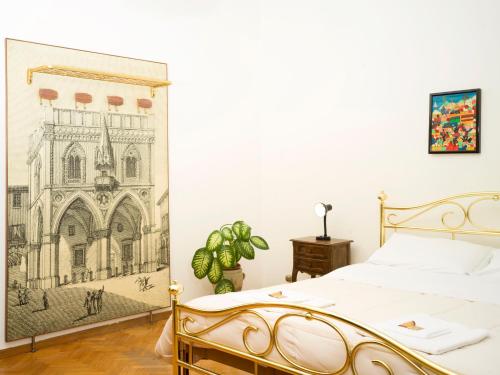 una camera con letto e disegno a muro di Affittacamere di Andrea Bertolino Bologna a Bologna