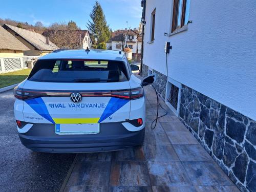 a car is parked next to a building at Holiday Home Toplica Natura with natural thermal Bath in Cerklje ob Krki