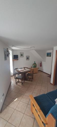 a living room with a ping pong table in it at ALBERGO DIFFUSO ORNICA NEL CUORE in Ornica