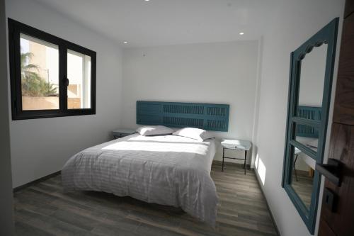 Кровать или кровати в номере Le bleu de l'Horizon